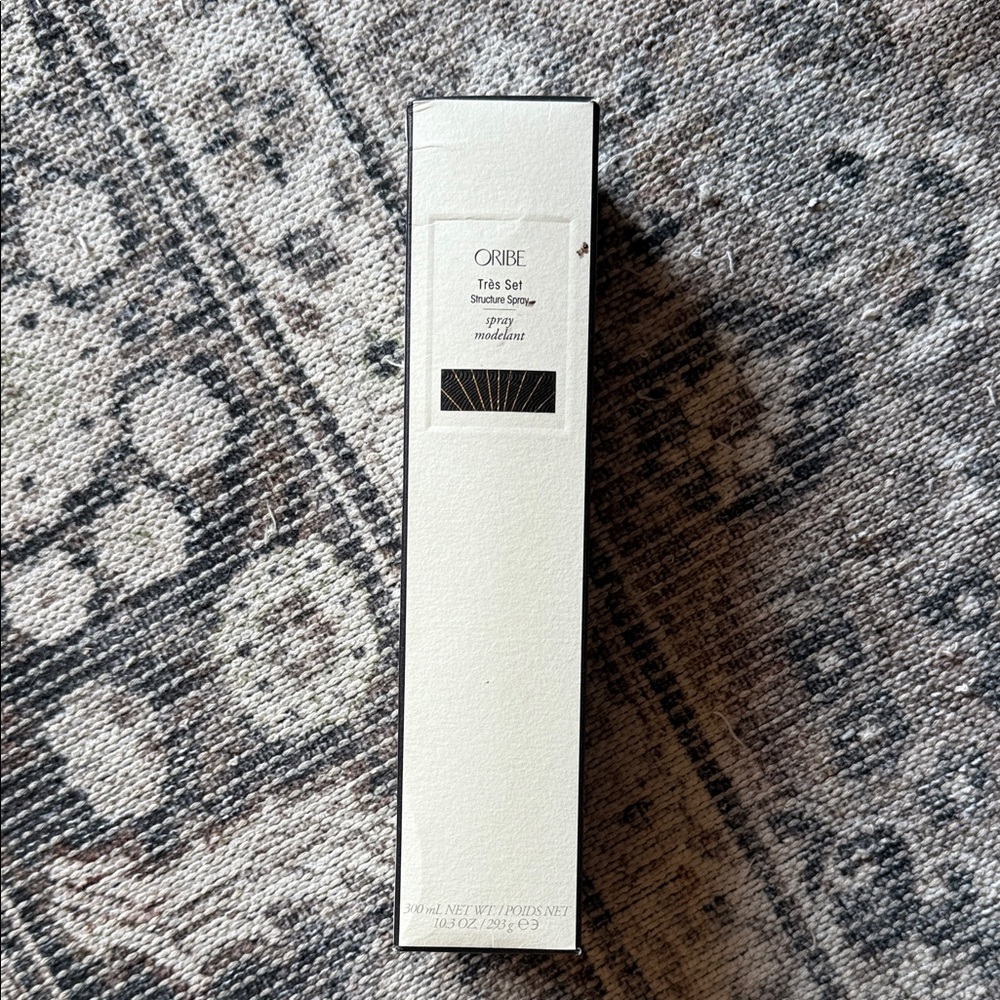 Oribe Thick & Set Spray in Cream and Black